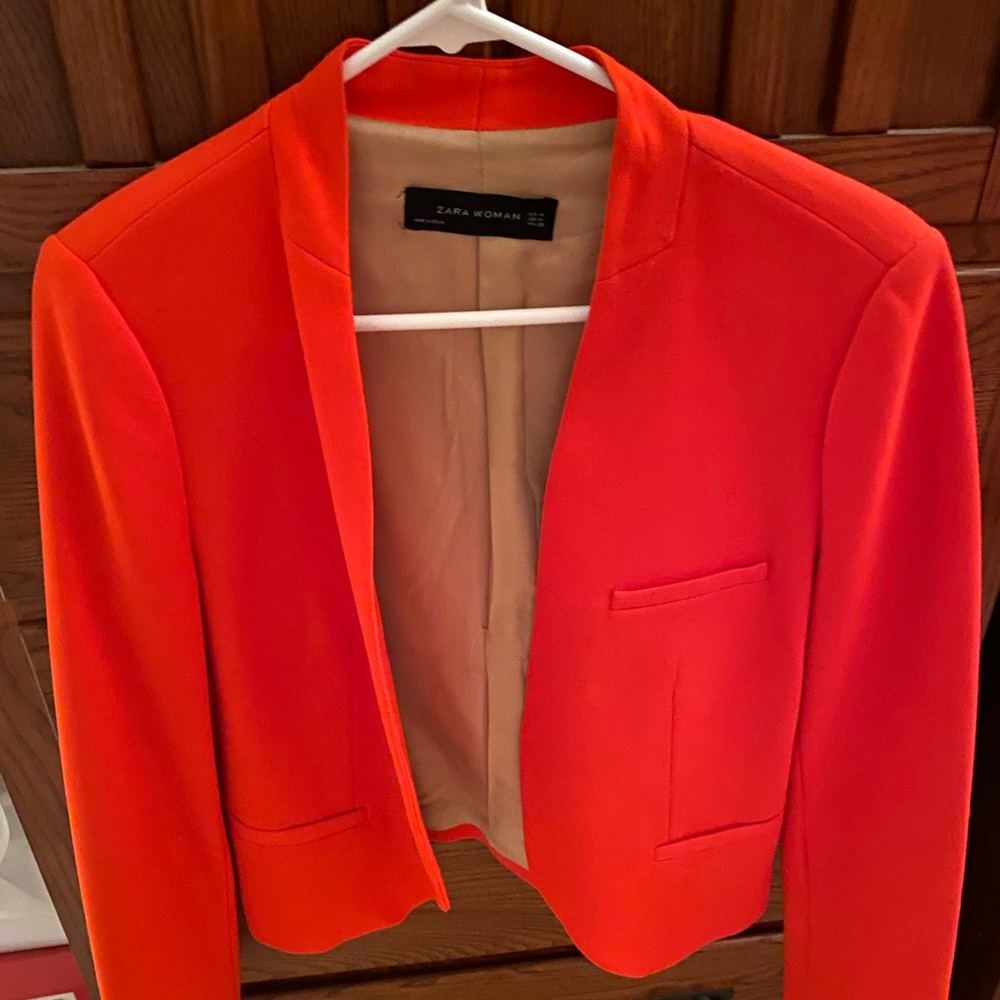 A woman’s classy suit jacket. Medium true to size.